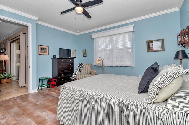 bedroom with ceiling fan, baseboards, and ornamental molding