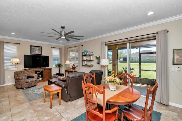 dining space with a textured ceiling, baseboards, and ornamental molding