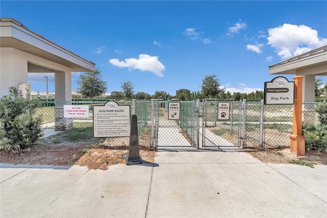 view of gate with fence