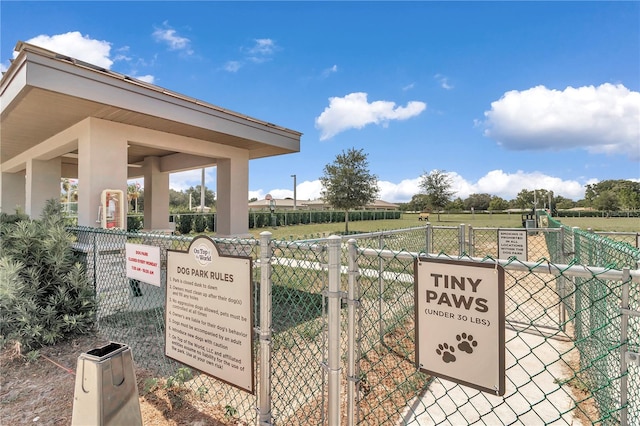 view of property's community with a gate and fence