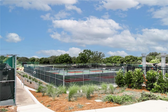 view of sport court with fence