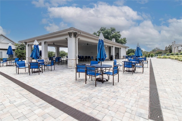 view of patio / terrace featuring outdoor dining space and a ceiling fan