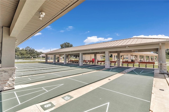 view of home's community featuring shuffleboard