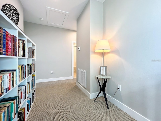 interior space with visible vents, carpet floors, and baseboards