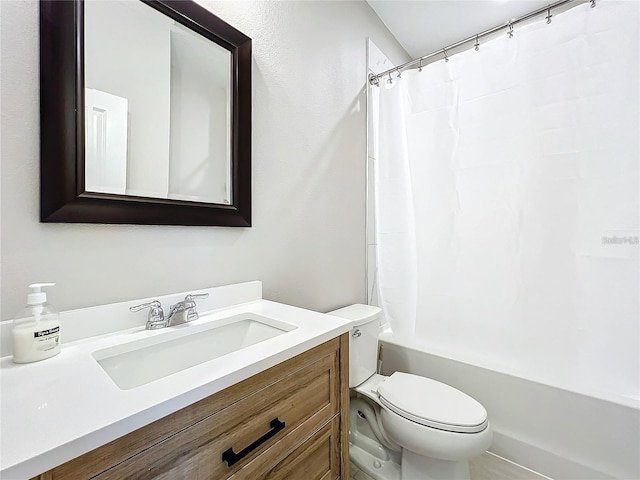 full bathroom featuring toilet, vanity, and shower / tub combo