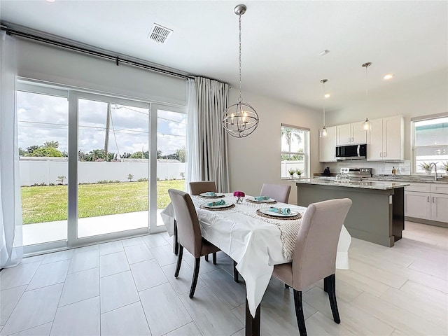 dining space with recessed lighting and visible vents