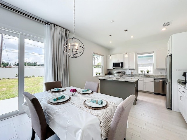 dining room featuring recessed lighting, visible vents, and a chandelier