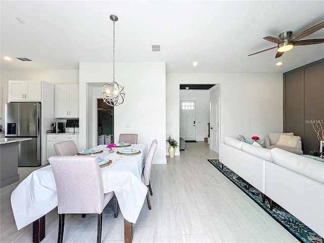 dining area featuring visible vents, recessed lighting, and ceiling fan with notable chandelier