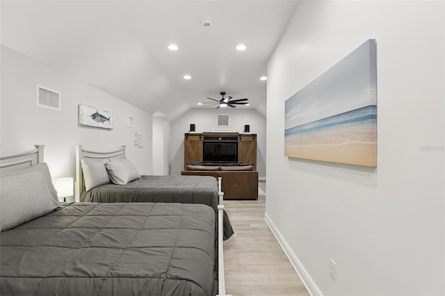 bedroom featuring visible vents, baseboards, lofted ceiling, recessed lighting, and light wood-style floors