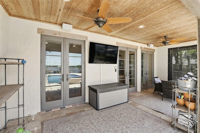 view of patio featuring french doors and ceiling fan