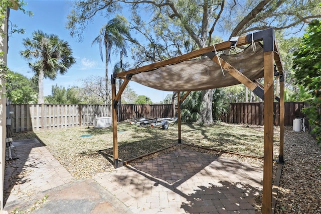 view of yard with a patio and a fenced backyard