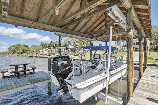 dock area with a water view and boat lift