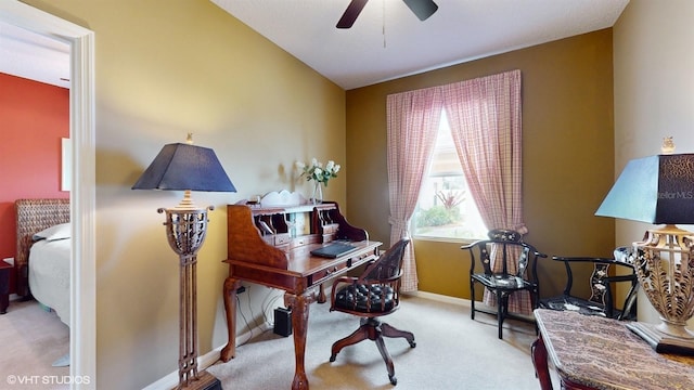 home office featuring carpet, baseboards, and ceiling fan