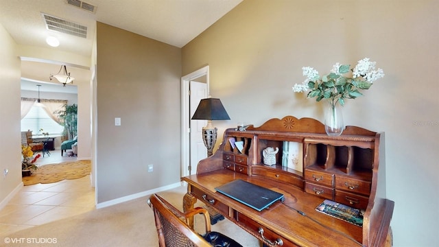 office area featuring tile patterned flooring, visible vents, carpet, and baseboards