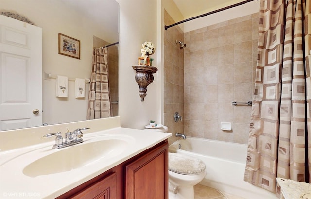 bathroom with vanity, tile patterned floors, toilet, and shower / bath combo with shower curtain