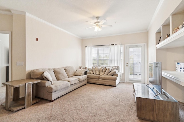 living area featuring light carpet, a ceiling fan, and ornamental molding