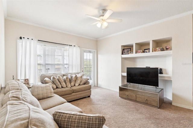 living room featuring crown molding, baseboards, ceiling fan, built in features, and carpet floors