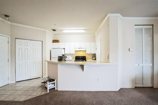 kitchen with light carpet, under cabinet range hood, white appliances, crown molding, and light countertops