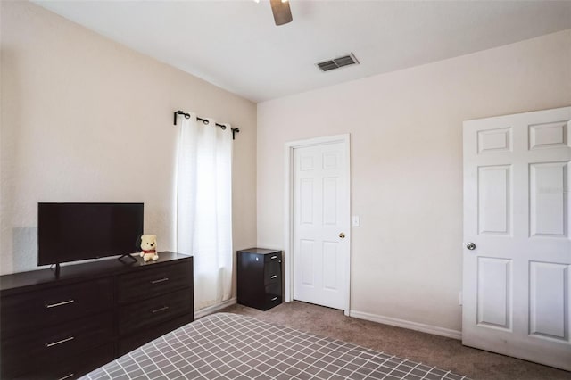 bedroom with visible vents, baseboards, light colored carpet, and ceiling fan