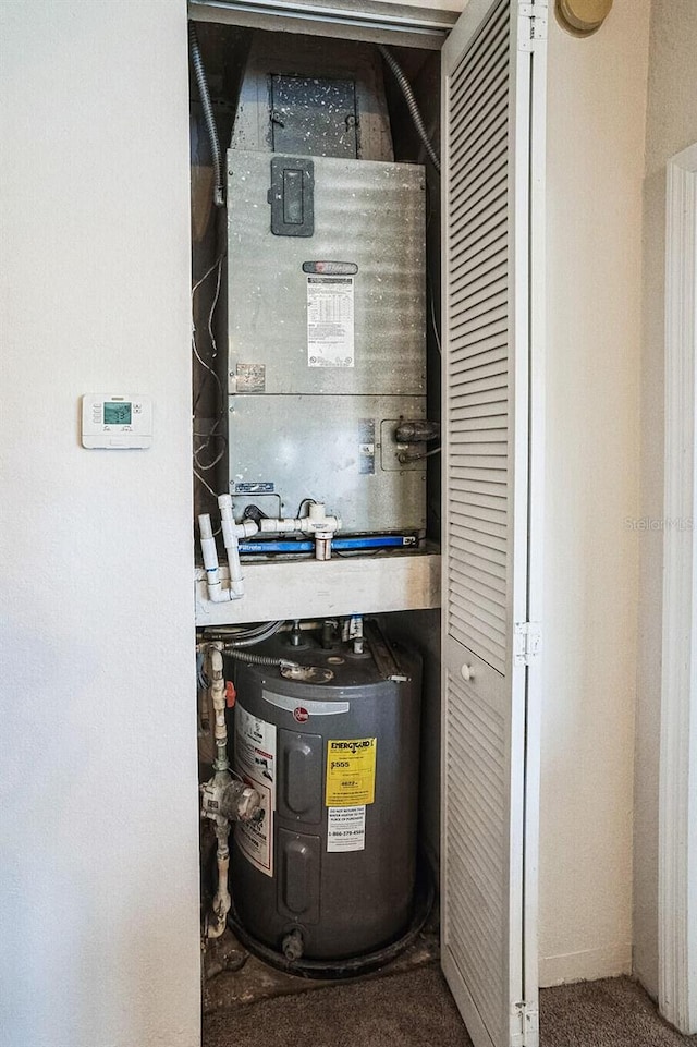 utility room with electric water heater