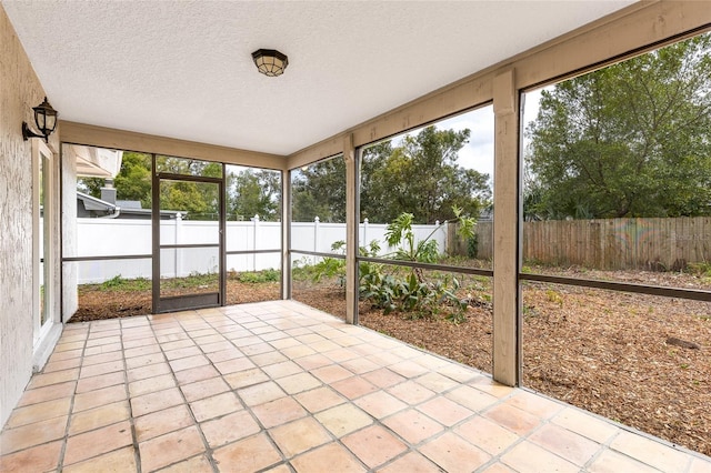 unfurnished sunroom featuring plenty of natural light