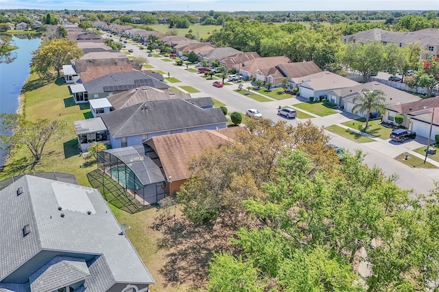 bird's eye view featuring a residential view and a water view