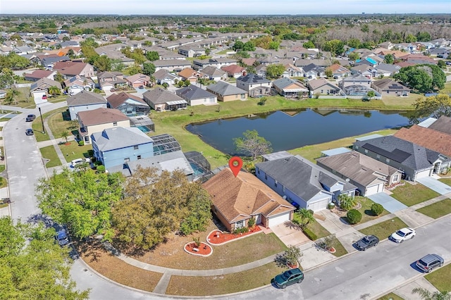 drone / aerial view featuring a residential view and a water view