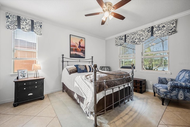 bedroom with light tile patterned floors, crown molding, and baseboards