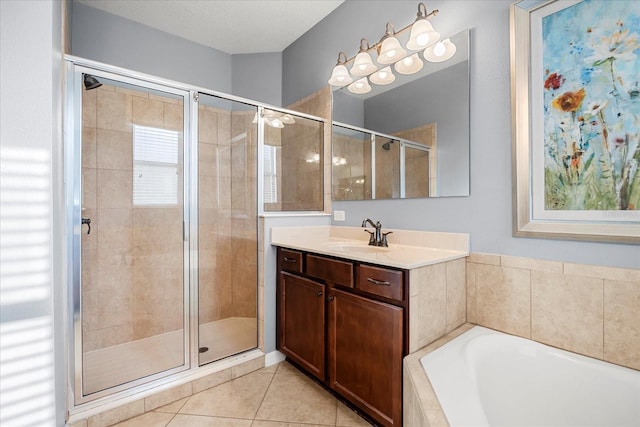 bathroom featuring vanity, tile patterned floors, a garden tub, and a stall shower