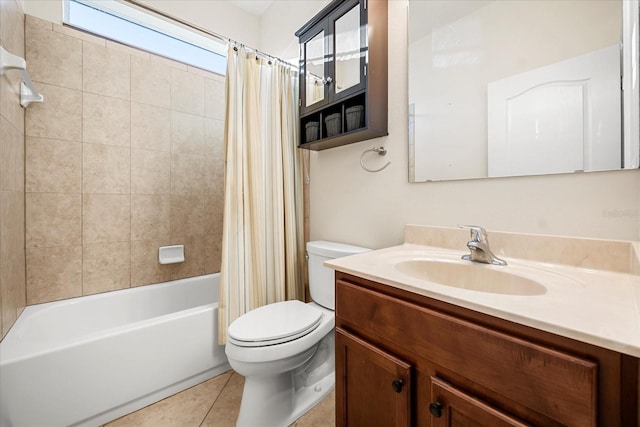 bathroom featuring vanity, tile patterned floors, toilet, and shower / bath combo with shower curtain