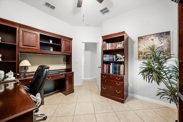 office space with light tile patterned flooring, visible vents, and ceiling fan