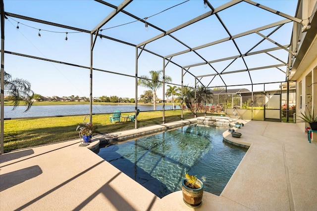 view of swimming pool featuring a pool with connected hot tub, a water view, glass enclosure, a lawn, and a patio