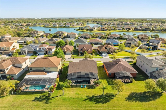 birds eye view of property featuring a residential view and a water view