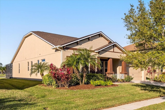 view of front of house featuring a front yard, an attached garage, roof with shingles, and stucco siding