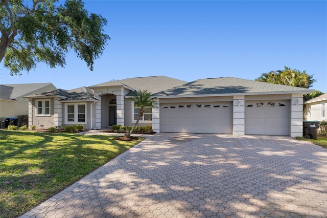 8611 Dover Oaks Ct, Orlando, FL 32836 - view of front of property featuring roof with shingles, a garage, a front lawn, and decorative driveway