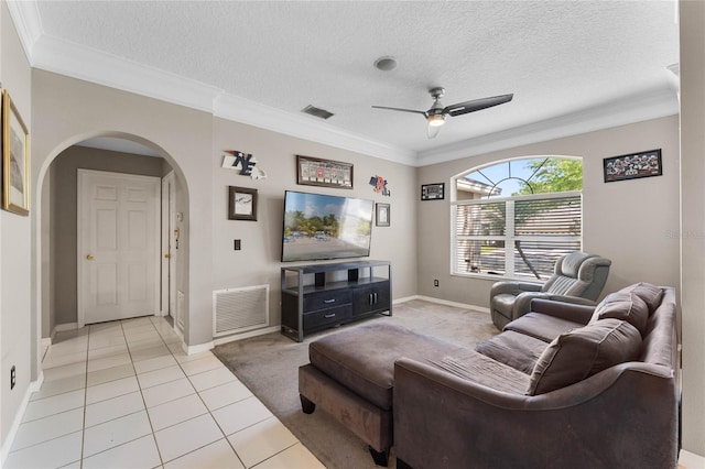 8611 Dover Oaks Ct, Orlando, FL 32836 - living area with arched walkways, ceiling fan, crown molding, and visible vents