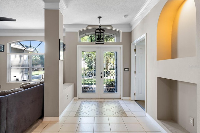 8611 Dover Oaks Ct, Orlando, FL 32836 - foyer with crown molding, french doors, plenty of natural light, and light tile patterned floors