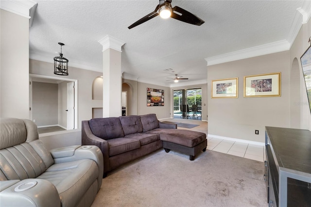 8611 Dover Oaks Ct, Orlando, FL 32836 - living area with arched walkways, a textured ceiling, a ceiling fan, and ornamental molding