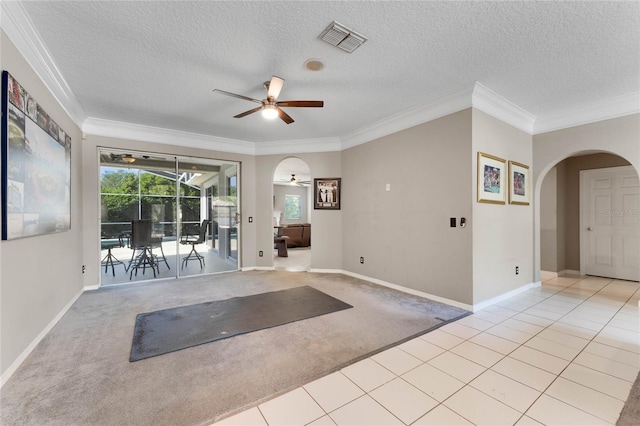 8611 Dover Oaks Ct, Orlando, FL 32836 - exercise room with arched walkways, ornamental molding, a ceiling fan, visible vents, and light carpet