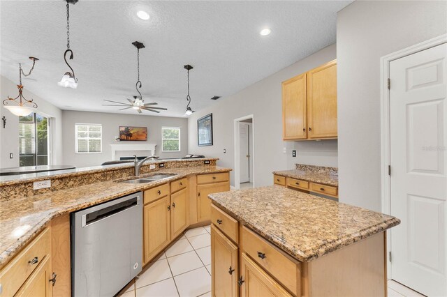 8611 Dover Oaks Ct, Orlando, FL 32836 - kitchen featuring light brown cabinetry, a ceiling fan, a kitchen island, dishwasher, and a sink