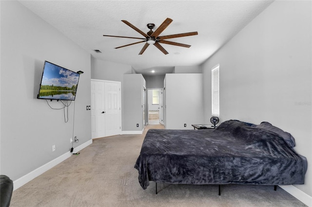8611 Dover Oaks Ct, Orlando, FL 32836 - carpeted bedroom featuring a textured ceiling, ensuite bathroom, baseboards, and visible vents