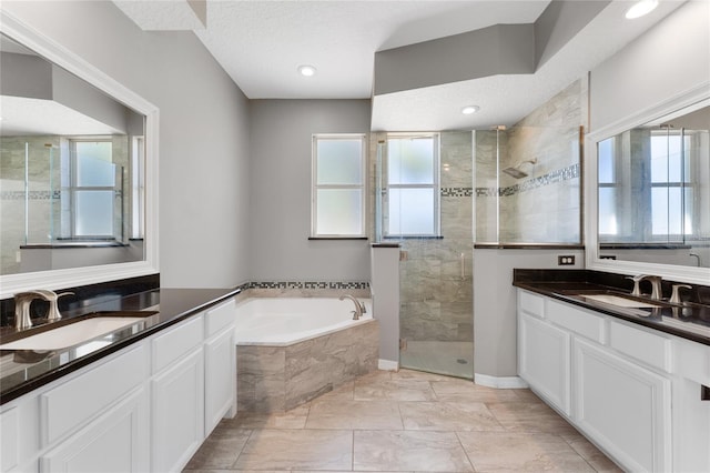 8611 Dover Oaks Ct, Orlando, FL 32836 - full bathroom with a stall shower, a garden tub, two vanities, and a sink