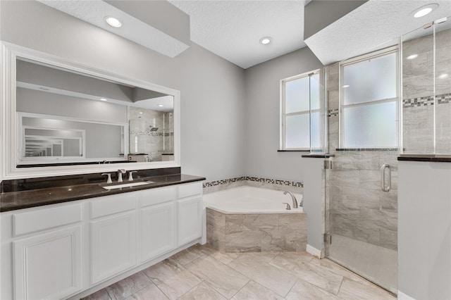 8611 Dover Oaks Ct, Orlando, FL 32836 - full bath featuring vanity, a textured ceiling, a shower stall, a bath, and marble finish floor