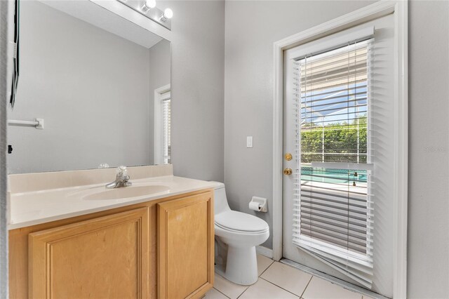 8611 Dover Oaks Ct, Orlando, FL 32836 - bathroom with toilet, tile patterned flooring, and vanity