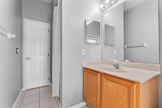 8611 Dover Oaks Ct, Orlando, FL 32836 - bathroom with tile patterned floors, vanity, and baseboards