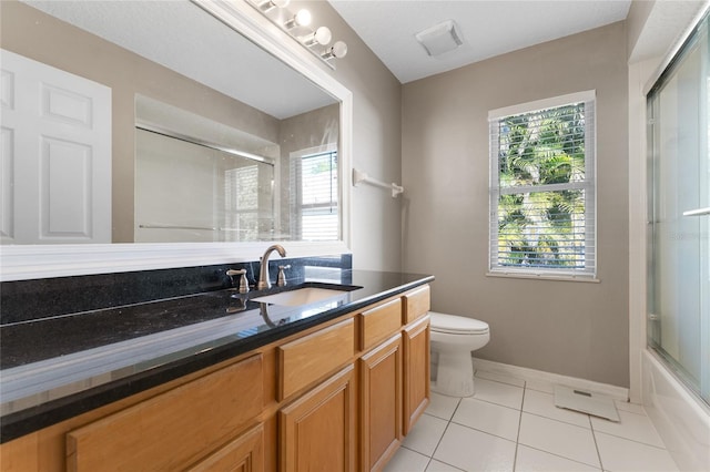8611 Dover Oaks Ct, Orlando, FL 32836 - full bath with tile patterned floors, vanity, baseboards, and toilet