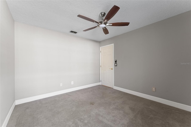 8611 Dover Oaks Ct, Orlando, FL 32836 - carpeted empty room with a textured ceiling, baseboards, a ceiling fan, and visible vents