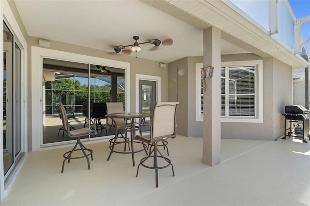 8611 Dover Oaks Ct, Orlando, FL 32836 - view of patio with grilling area, outdoor dining space, and a ceiling fan