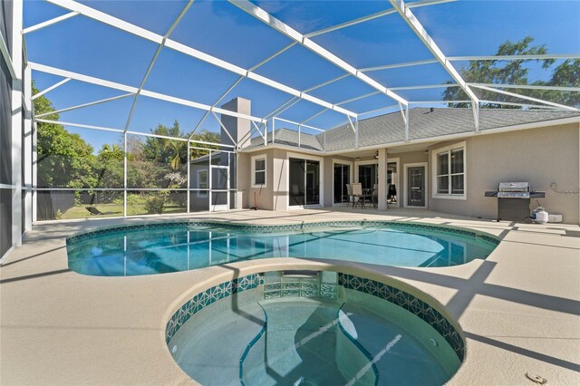 8611 Dover Oaks Ct, Orlando, FL 32836 - pool featuring a patio, an in ground hot tub, grilling area, and glass enclosure