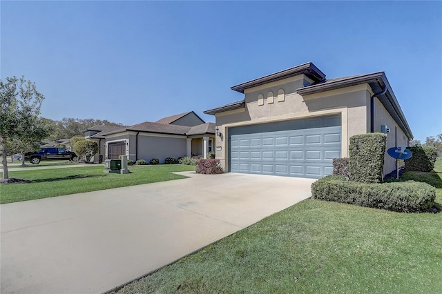 prairie-style house featuring a garage, stucco siding, concrete driveway, and a front yard